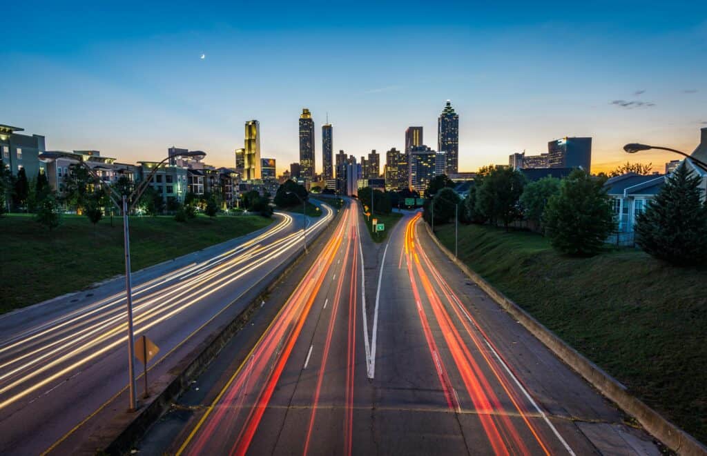 pexels photo 185662 185662 Stunning dusk view of Atlanta skyline with light trails on a busy highway, capturing urban vibrancy.